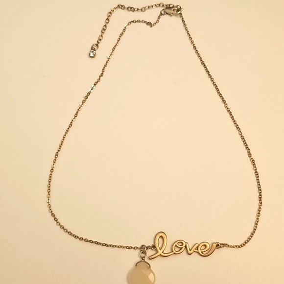 Elegant Gold Necklace with Milk Glass Teardrop Pendant and Circular Accents - Picture 3 of 5
